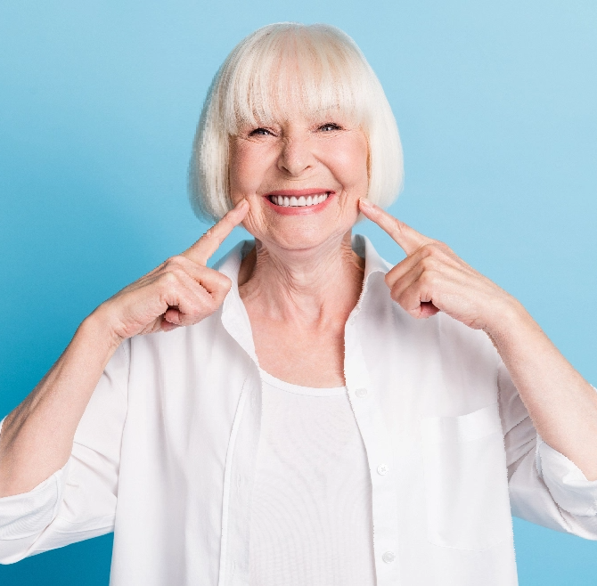 woman pointing at Dentures